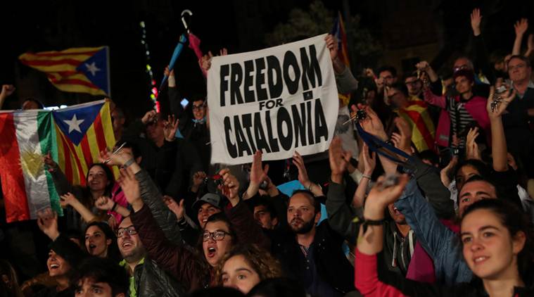 People react as they gather at Plaza Catalunya after voting ended for the banned independence referendum, in Barcelona, Spain October 1, 2017. REUTERS/Susana Vera